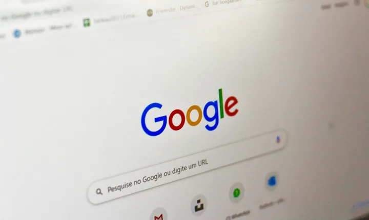 Google homepage on a laptop screen representing high-intent search advertising.