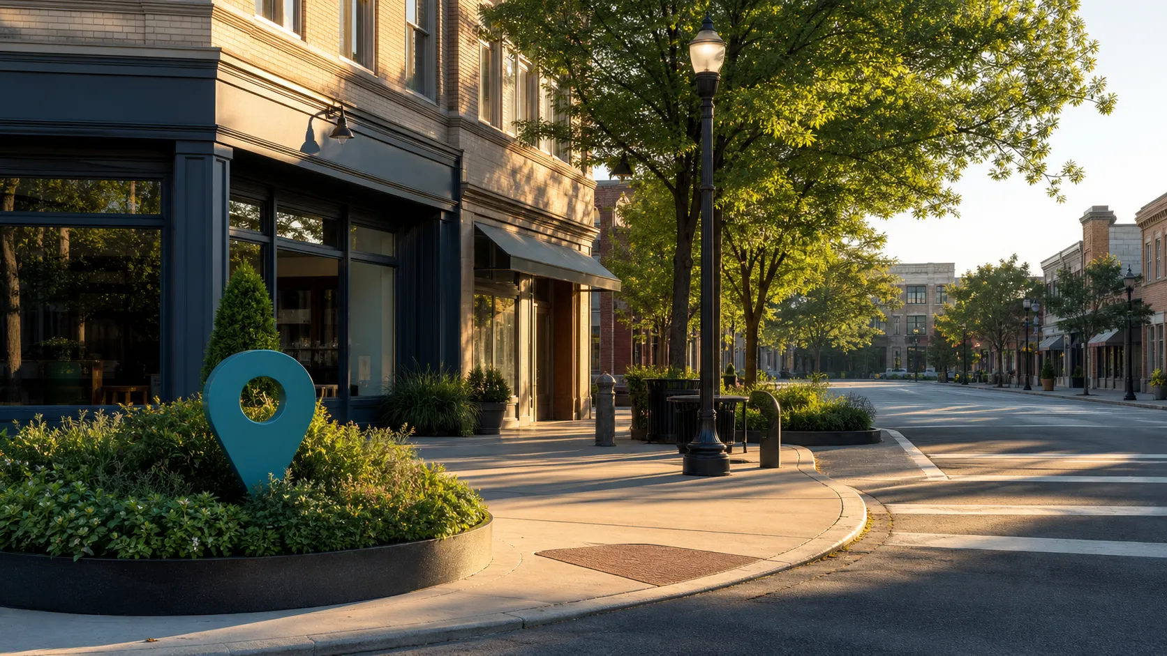 Quiet neighborhood commercial street with a teal location marker sculpture beside a storefront.